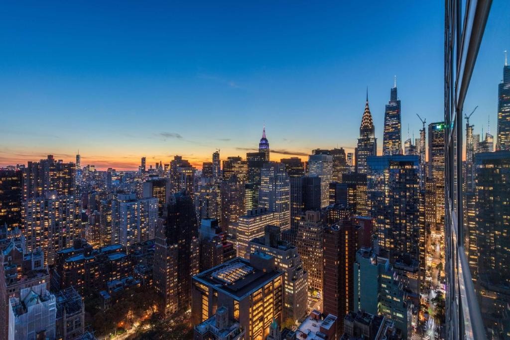 Your Private Observation Deck - Take in breathtaking views of the Manhattan skyline right from your room.