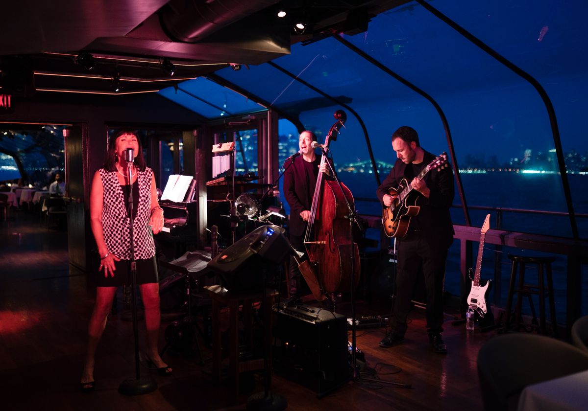 A Night of Glamour: Live Music & Gourmet Dining with the New York City Skyline Panorama